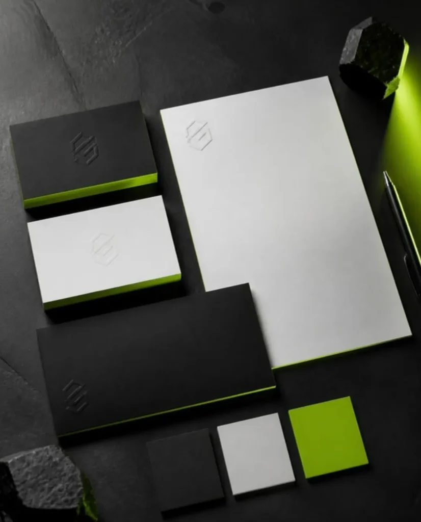 Premium brand identity concept with business cards and stationery in black, white and lime